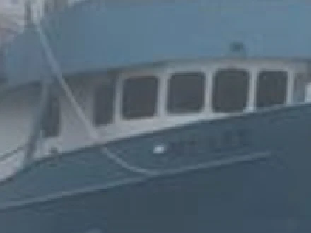 Wheelhouse windows of a fishing boat in a soft photo, enlarged until the pixels show