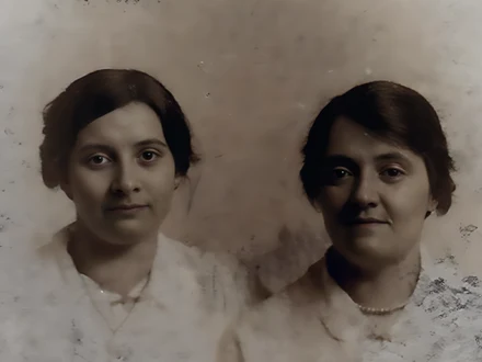 The same photo restored: cast and specks gone, eyes and mouths clear